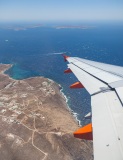 Leaving Mykonos with Dilos and Rineia in the distance
