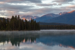 First light on Mount Edith Cavell reflected in Beauvert Lake